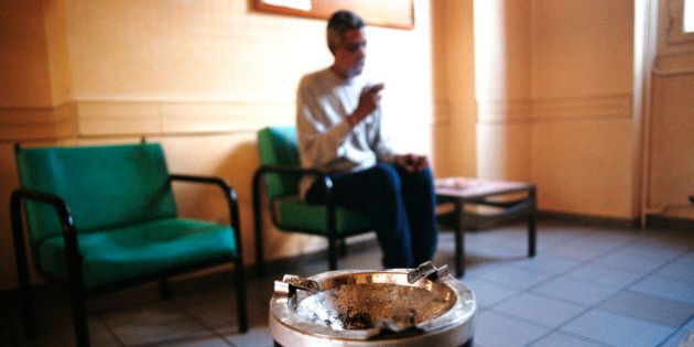 Photo Essay From Hospital. Paul Guiraud Hospital, In The French Region Of Ile De France. Department Of Psychiatry. Patient In Smoking Area. (Photo By BSIP/UIG Via Getty Images)