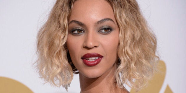 Beyonce poses in the press room at the 56th annual GRAMMY Awards at Staples Center on Sunday, Jan. 26, 2014, in Los Angeles. (Photo by Dan Steinberg/Invision/AP)