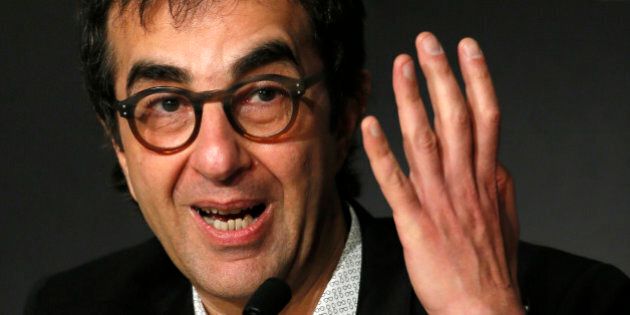 Director Atom Egoyan speaks during a press conference for Captives at the 67th international film festival, Cannes, southern France, Friday, May 16, 2014. (AP Photo/Alastair Grant)