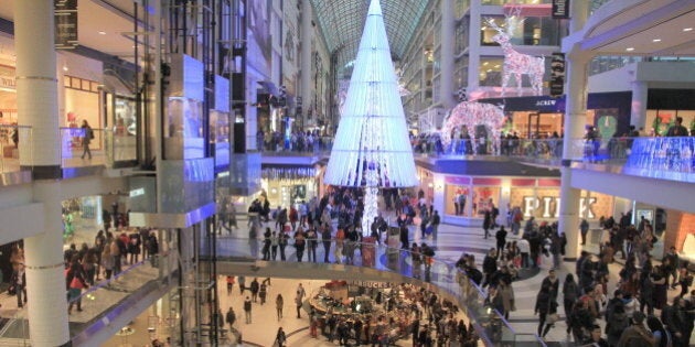 TORONTO - NOVEMBER 23: Christmas shopping at the Eaton Centre on November 23, 2012 in Toronto. The mall contains a wide selection of 230 stores and restaurants.