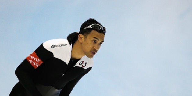 HEERENVEEN, NETHERLANDS - MARCH 08: Gilmore Junio of Canada looks on after he competes in the Mens 500m during Day 1 of the Essent ISU World Cup Speed Skating Championships 2013 at Thialf Stadium on March 8, 2013 in Heerenveen, Netherlands. (Photo by Dean Mouhtaropoulos/Getty Images)