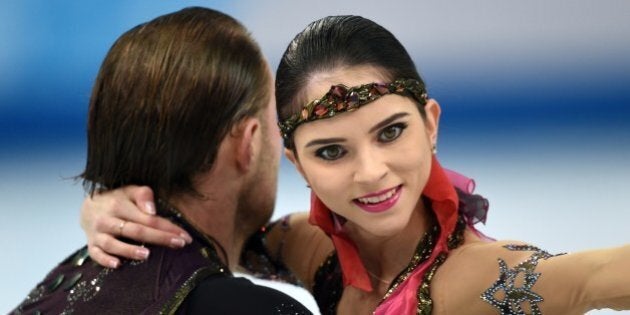 Russia's Yuri Larionov and Russia's Vera Bazarova perform their Figure Skating Pairs Free Program at the Iceberg Skating Palace during the Sochi Winter Olympics on February 12, 2014. AFP PHOTO / DAMIEN MEYER (Photo credit should read DAMIEN MEYER/AFP/Getty Images)