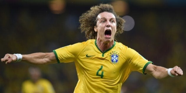 Brazil's defender David Luiz celebrates scoring during the quarter-final football match between Brazil and Colombia at the Castelao Stadium in Fortaleza during the 2014 FIFA World Cup on July 4, 2014. AFP PHOTO / VANDERLEI ALMEIDA (Photo credit should read VANDERLEI ALMEIDA/AFP/Getty Images)