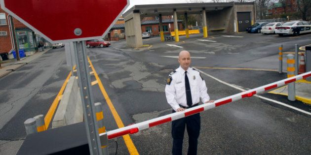 In this Nov. 14, 2012 photo, Miguel Begin, the chief of operations for the Canada Border Services Agency's Stanstead sector, stands at the Canadian port of entry in Stanstead, Quebec. Canadian immigration officials on Wednesday, Dec. 5, 2012 said a Romanian smuggling ring has been bringing Gypsies into the U.S. through Mexico in order for them to eventually gain asylum in Canada. Over the past year, cars loaded with ethnic Roma asylum seekers have run the border between Derby Line, Vermont and Stanstead. (AP Photo/Toby Talbot)