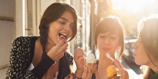 three girlfriends eating icecream