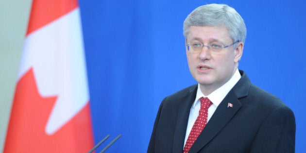 BERLIN, GERMANY - MARCH 27: Canadian Prime Minister Stephen Harper speaks during a press conference with German Chancellor Angela Merkel (not seen) after their meeting in the chancellery, Berlin, Germany on March 27, 2014. (Photo by Cuneyt Karadag/Anadolu Agency/Getty Images)