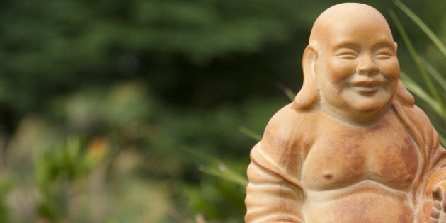 small terracotta buddha...