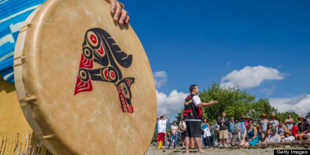 Chief Justin George of Tsleil-Waututh Nation at commencement of Many People, One Canoe. Salish First Nations, Gathering of Canoes to Protect the Salish Sea, Ambleside Park, W. Vancouver, BC, Canada