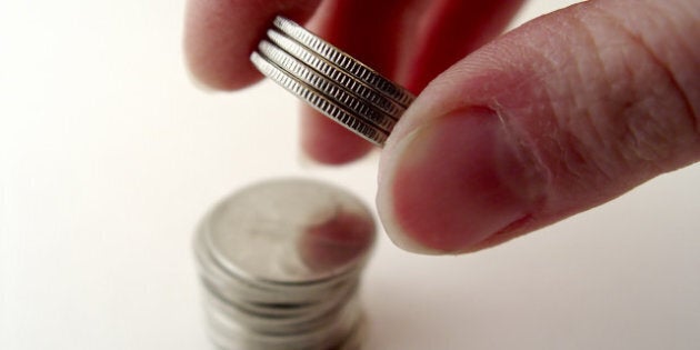 person stacking up money