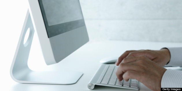 Business man using computer in office,close up