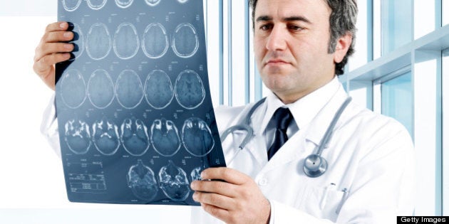 Medical doctor analyzing a CT scan