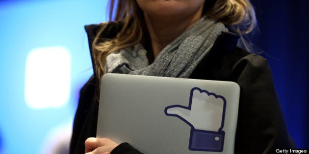 MENLO PARK, CA - APRIL 04: A Facebook employee holds a laptop with a 'like' sticker on it during an event at Facebook headquarters during an event at Facebook headquarters on April 4, 2013 in Menlo Park, California. Facebook CEO Mark Zuckerberg announced a new product for Android called Facebook Home as well as the new HTC First phone that will feature the new software. (Photo by Justin Sullivan/Getty Images)