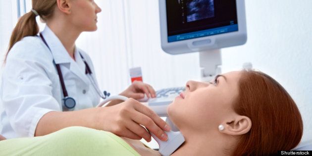 woman getting ultrasound of a...