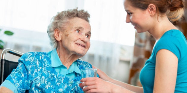 senior woman with her caregiver ...