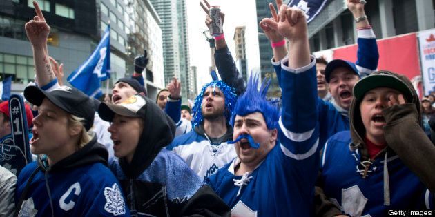 TORONTO, ON - MAY 12: Toronto Maple Leaf fans cheered outside of the ACC Sunday night during game 6 of the Boston-Toronto series. (Lucas Oleniuk/Toronto Star via Getty Images)