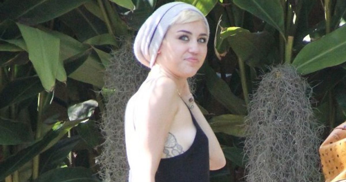 Miley Cyrus Flashes Sideboob, Puts Engagement Ring Back On (PHOTO)