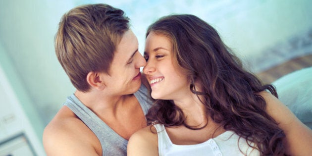 handsome guy embracing his...