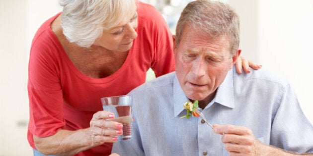 senior woman looking after sick ...
