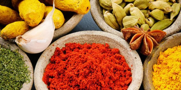 colorful mix of spices on stone ...