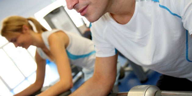 man exercising on bicycle in...