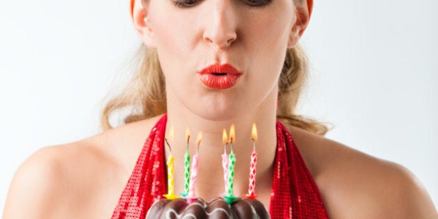 woman celebrating birthday with ...