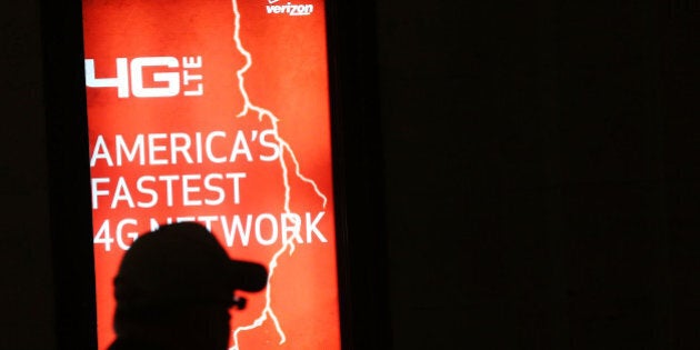 NEW YORK, NY - JUNE 07: People walk by a Verizon advertisement on June 7, 2013 in New York City. In a statement today U.S. President Barack Obama defended the government's surveillance programs following a news leak on June 5 that the U.S. government had been obtaining Verizon's phone records for years. The records were obtained through a secret court order which also revealed that the government has been monitoring business phone calls both nationally and internationally. (Photo by Spencer Platt/Getty Images)