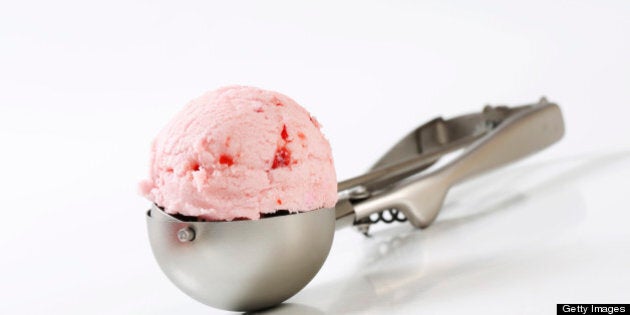 scoop of fresh strawberry ice cream on a scooper