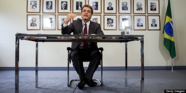 Brazilian Roberto Azevedo gestures during press conference after he has been officially named to take the helm of the World Trade Organization (WTO) on May 8, 2013 in Geneva. The fifty-five-year-old career diplomat, Brazil's WTO ambassador since 2008, had defeated veteran Mexican trade negotiator Herminio Blanco in the final round of the contest to become the first official from the BRICS group of emerging economies to head the trade organisation. AFP PHOTO / FABRICE COFFRINI (Photo credit should read FABRICE COFFRINI/AFP/Getty Images)