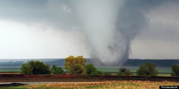 white cone tornado moves across ...