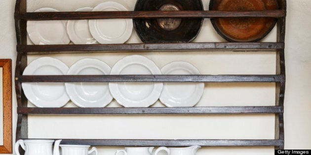 Kitchen Shelves. Old spice cupboard loaded with dishes.