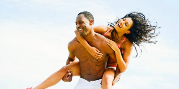 Happy Young Couple Having fun outdoors