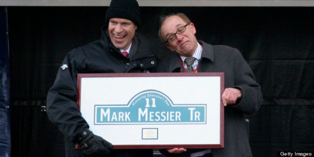 EDMONTON, CANADA - FEBRUARY 26: Former Edmonton Oilers Mark Messier #11 laughs as City of Edmonton Mayor Stephen Mandel hams it up at the unveiling of Mark Messier trail during a Civic Ceremony honoring him at Sir Winston Churchill Square on Monday, February 26, 2007 in Edmonton. Despite the bitter cold hundreds of Oilers fans came out to pay tribute to Messier, who will have his #11 retired tomorrow night at Rexall Place prior to the Oilers match against the Phoenix Coyotes. The city of Edmonton honored Messier by renaming a portion of St. Albert Trail as Mark Messier Trail. (Photo by Tim Smith/Getty Images)