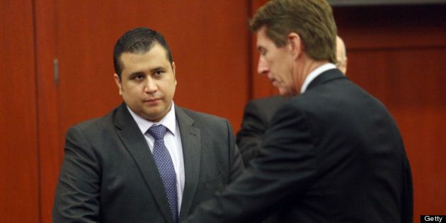 SANFORD, FL - JULY 03: George Zimmerman, left, and Defense attorney Mark O'Mara chat during an early morning recess in Zimmerman's trial in Seminole circuit court, July 3, 2013 in Sanford, Florida. Zimmerman is charged with second-degree murder for the February 2012 shooting death of 17-year-old Trayvon Martin. (Photo by Jacob Langston-Pool/Getty Images)