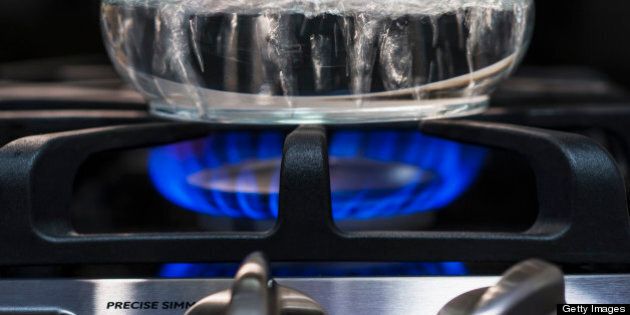 Close-up of water boiling on gas burner
