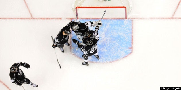 LOS ANGELES, CA - MAY 23: The Los Angeles Kings celebrate after defeating the San Jose Sharks in Game Five of the Western Conference Semifinals during the 2013 NHL Stanley Cup Playoffs at Staples Center on May 23, 2013 in Los Angeles, California. (Photo by Andrew D. Bernstein/NHLI via Getty Images)