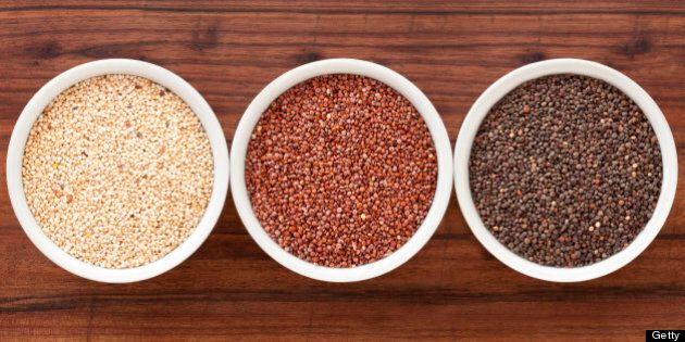 Three bowls containing quinoa varieties