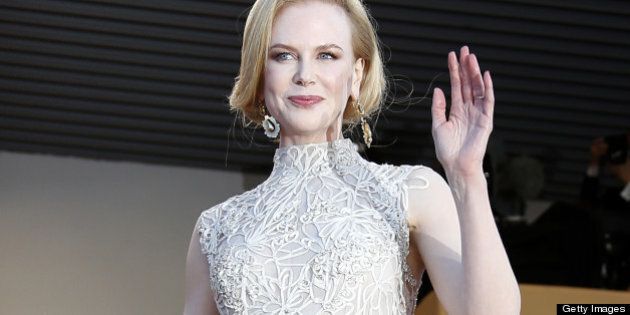 Australian actress and member of the Feature Film Jury Nicole Kidman waves on May 23, 2013 as she arrives with fellow Jury member, Taiwanese director Ang Lee, for the screening of the film 'Nebraska' presented in Competition at the 66th edition of the Cannes Film Festival in Cannes. Cannes, one of the world's top film festivals, opened on May 15 and will climax on May 26 with awards selected by a jury headed this year by Hollywood legend Steven Spielberg. AFP PHOTO / VALERY HACHE (Photo credit should read VALERY HACHE/AFP/Getty Images)