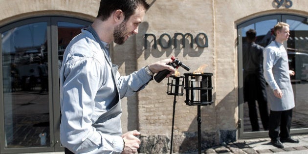 A staff member lights a candle outside Noma restaurant in Copenhagen on May 1, 2012. Denmark's Noma restaurant has been named the best in the world for a third year running in an international survey that also gave top rankings to establishments in Spain, Brazil and Italy. AFP PHOTO/Keld Navntoft/Scanpix (Photo credit should read KELD NAVNTOFT/AFP/GettyImages)