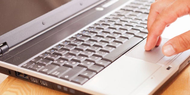 man's hand on the keyboard
