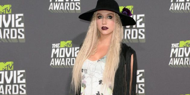 CULVER CITY, CA - APRIL 14: Singer Ke$ha arrives at the 2013 MTV Movie Awards at Sony Pictures Studios on April 14, 2013 in Culver City, California. (Photo by Jason Merritt/Getty Images)
