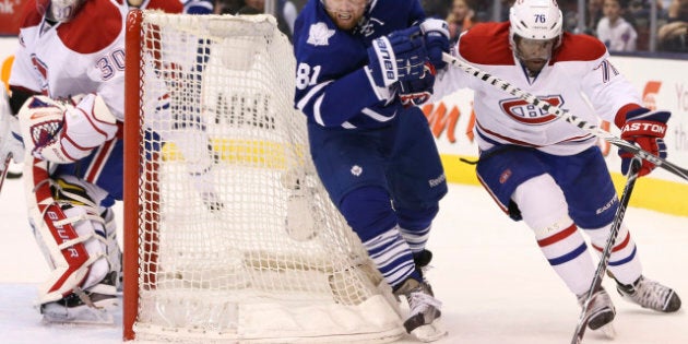 TORONTO, ON - APRIL 13: Toronto Maple Leafs Phil Kessel cuts around the Montreal Canadiens Peter Budaj's goal while pursuing Canadiens defenseman P.K. Subban during third period NHL action at the Air Canada Centre. (Andrew Francis Wallace/Toronto Star via Getty Images)