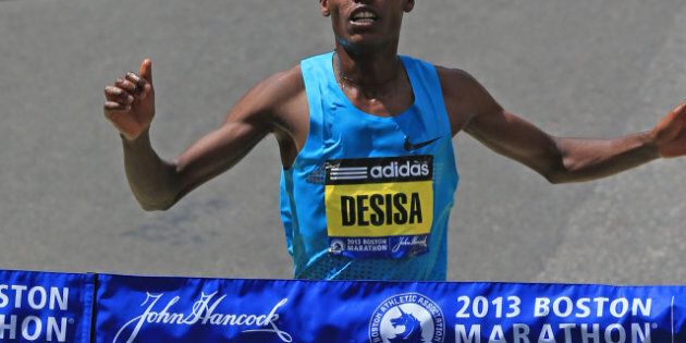 BOSTON - APRIL 15: Lelisa Desisa, 23, of Ethiopia, crosses the finish line to win the men's race at the 117th Boston Marathon on April 15, 2013. (Photo by David L. Ryan/The Boston Globe via Getty Images)