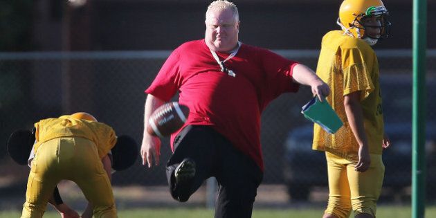 TORONTO, ON - SEPTEMBER 12: Toronto Mayor Rob Ford punts as he runs football practice at Don Bosco Secondary School after leaving City Hall before 2 pm in Toronto. (Steve Russell/Toronto Star via Getty Images)