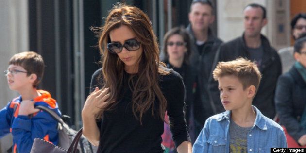 PARIS, FRANCE - APRIL 21: Victoria Beckham and her son Romeo James are seen leaving the 'NIKE' store on the Champs-Elysees Avenue on April 21, 2013 in Paris, France. (Photo by Marc Piasecki/FilmMagic)
