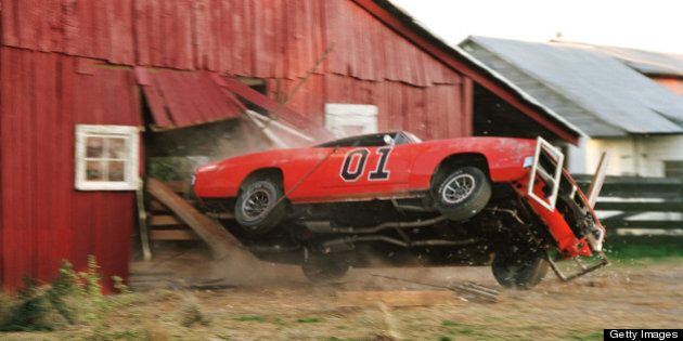 UNSPECIFIED - JULY 14: Full shot of General Lee crashing through barn. (Photo by Van Redin/Warner Bros./Getty Images)