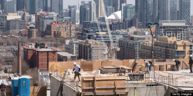 TORONTO, ON - APRIL 26: Construction workers are seen working on a condo building on Sudbury Street near Dovercourt Rd. (Carlos Osorio/Toronto Star via Getty Images)