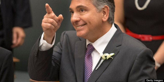 TORONTO, ON - MAY 2: Finance Minister Charles Sousa points to the gallery prior to tabling at $127.6-billion spending plan Thursday, making official what he had been telegraphing for days. (Andrew Francis Wallace/Toronto Star via Getty Images)