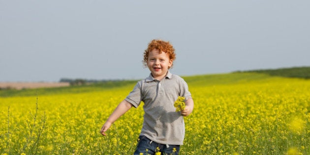 ginger baby boy with a bouquet...