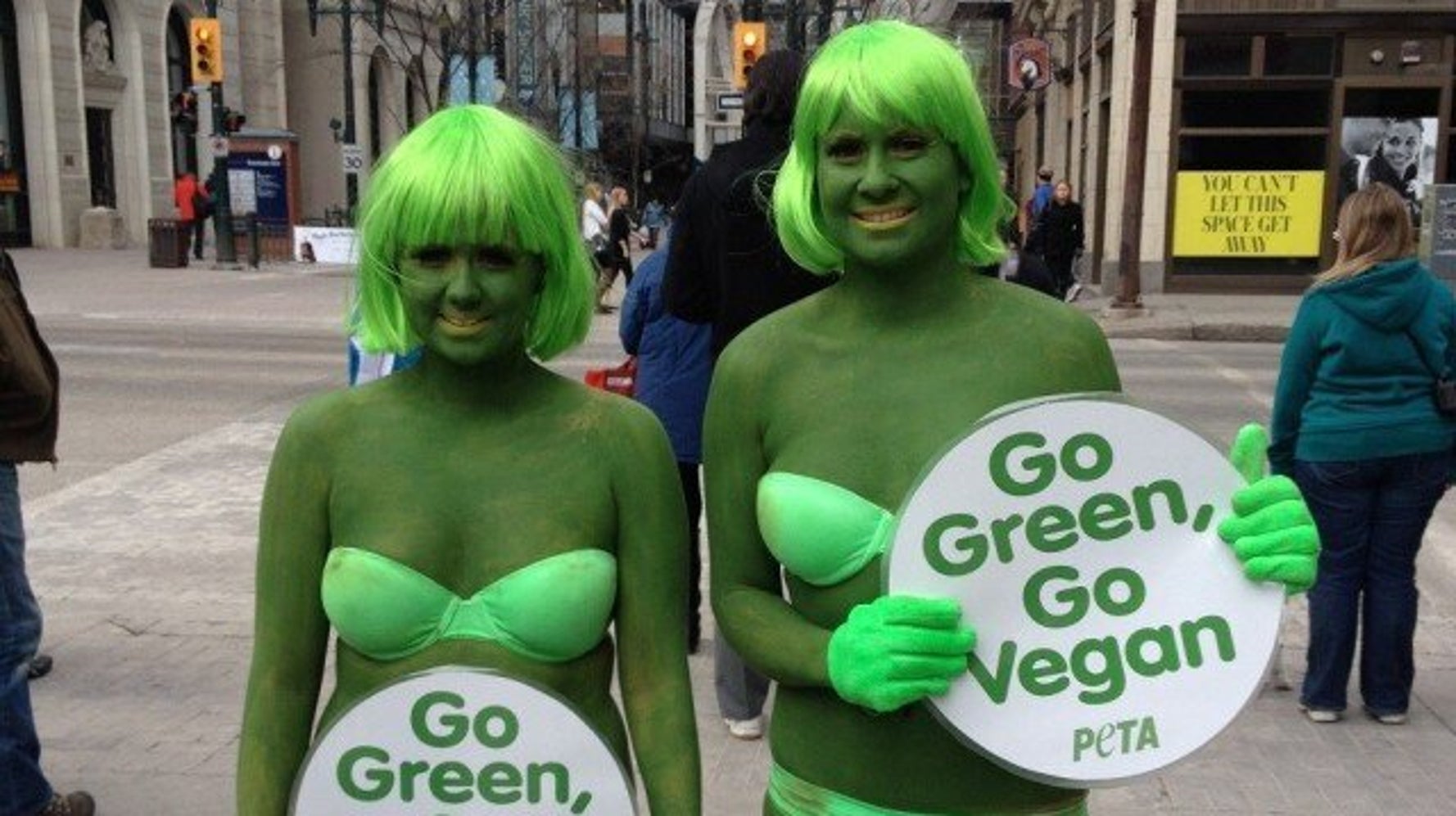 PETA Protest Calgary Activists In Green Bikinis, Bodypaint On Stephen