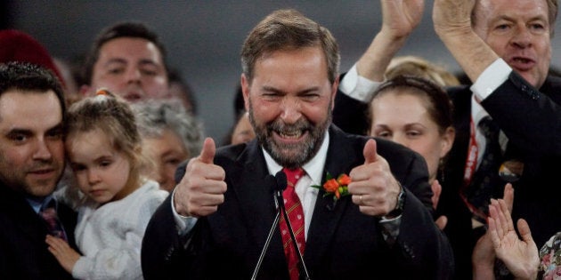 Thomas Mulcair celebrates his win at the NDP leadership convention in Toronto, Ontario, March 24, 2012. Canada's social democrats Saturday chose a firebrand center-leaning MP to run for prime minister in 2015, after the death of a leader who led them to into the opposition benches in a historic ballot last year. Former deputy leader Thomas Mulcair won the New Democratic Party nomination with 33,881 votes, beating out six rivals by vowing to track the NDP to the center to appeal to a broader electorate and consolidate its recent gains. AFP PHOTO / Geoff Robins (Photo credit should read GEOFF ROBINS/AFP/Getty Images)